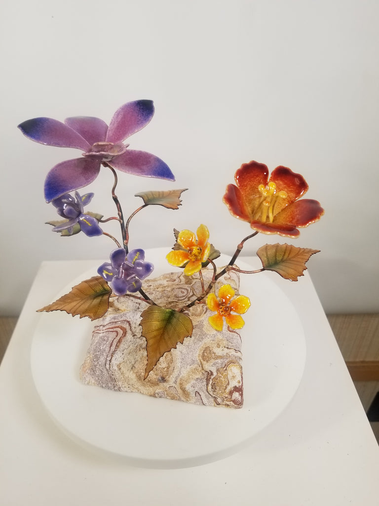 Orchid withtrumpet flower on stone Wall Art by Bovano